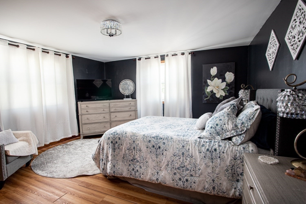 425 Pearce Street Fall River, MA 02720 - Photo 26 of 33 a bedroom with a bed and dresser with mirror