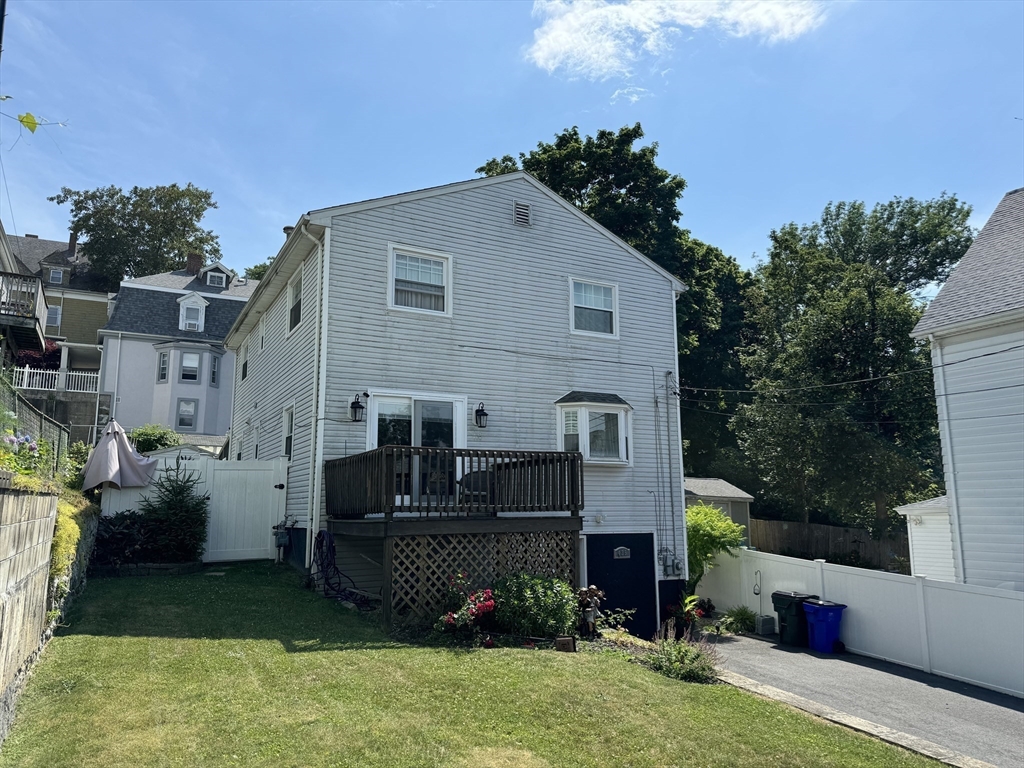 425 Pearce Street Fall River, MA 02720 - Photo 4 of 33 a front view of a house with a garden