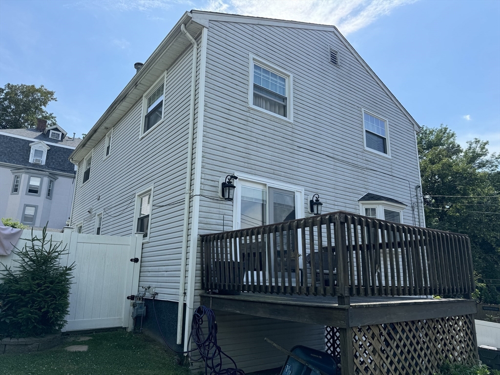425 Pearce Street Fall River, MA 02720 - Photo 5 of 33 a view of a house with wooden deck