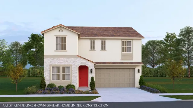 a front view of house with yard and trees in the background
