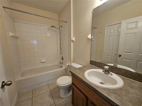 a bathroom with a sink a toilet and a bathtub
