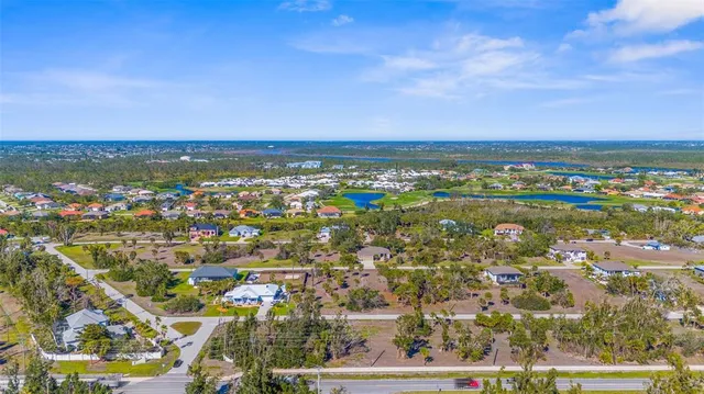 an aerial view of residential building and ocean