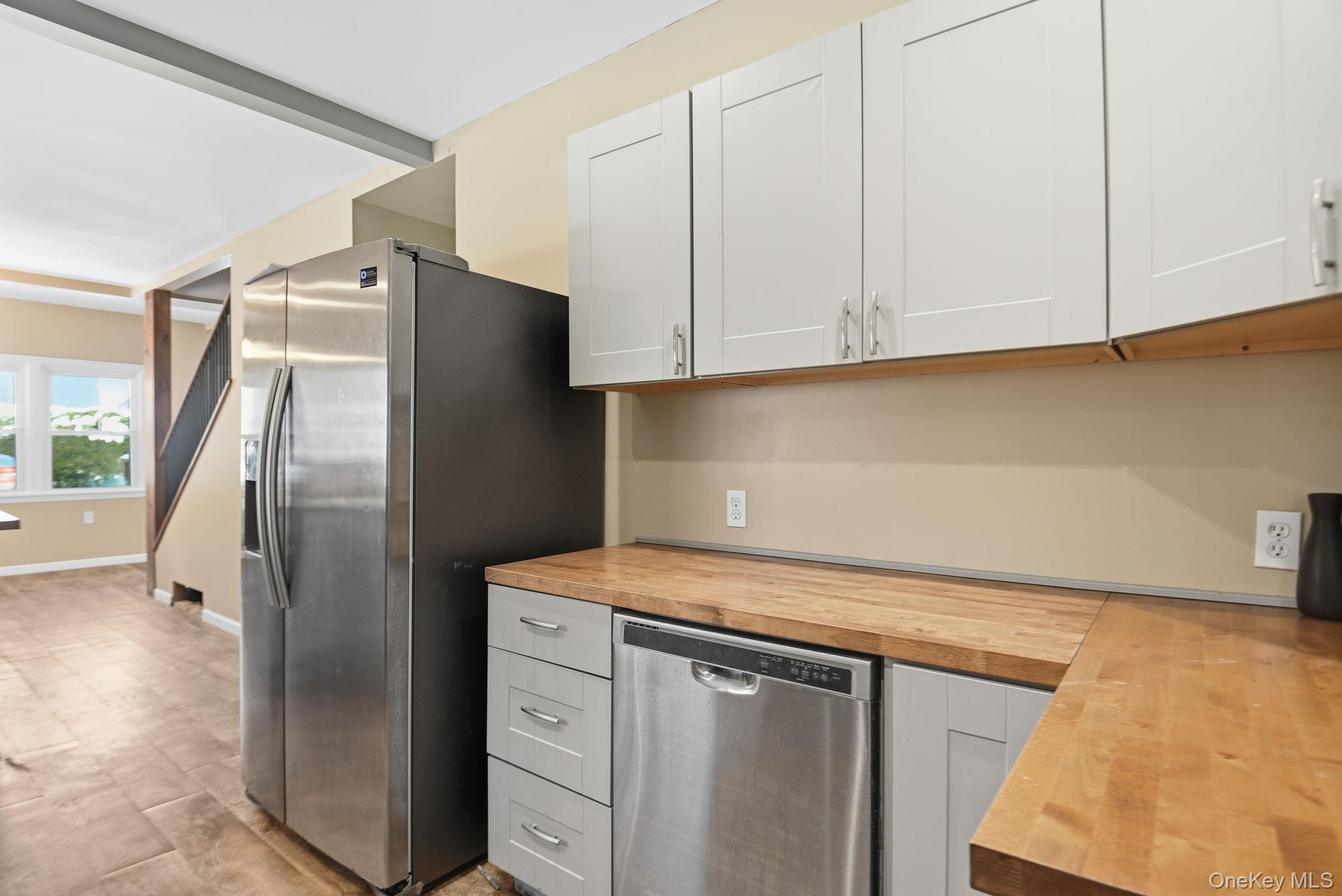 35 Shady Creek Road Pleasant Valley, NY 12569 - Photo 15 of 33 a kitchen with stainless steel appliances white cabinets and a refrigerator
