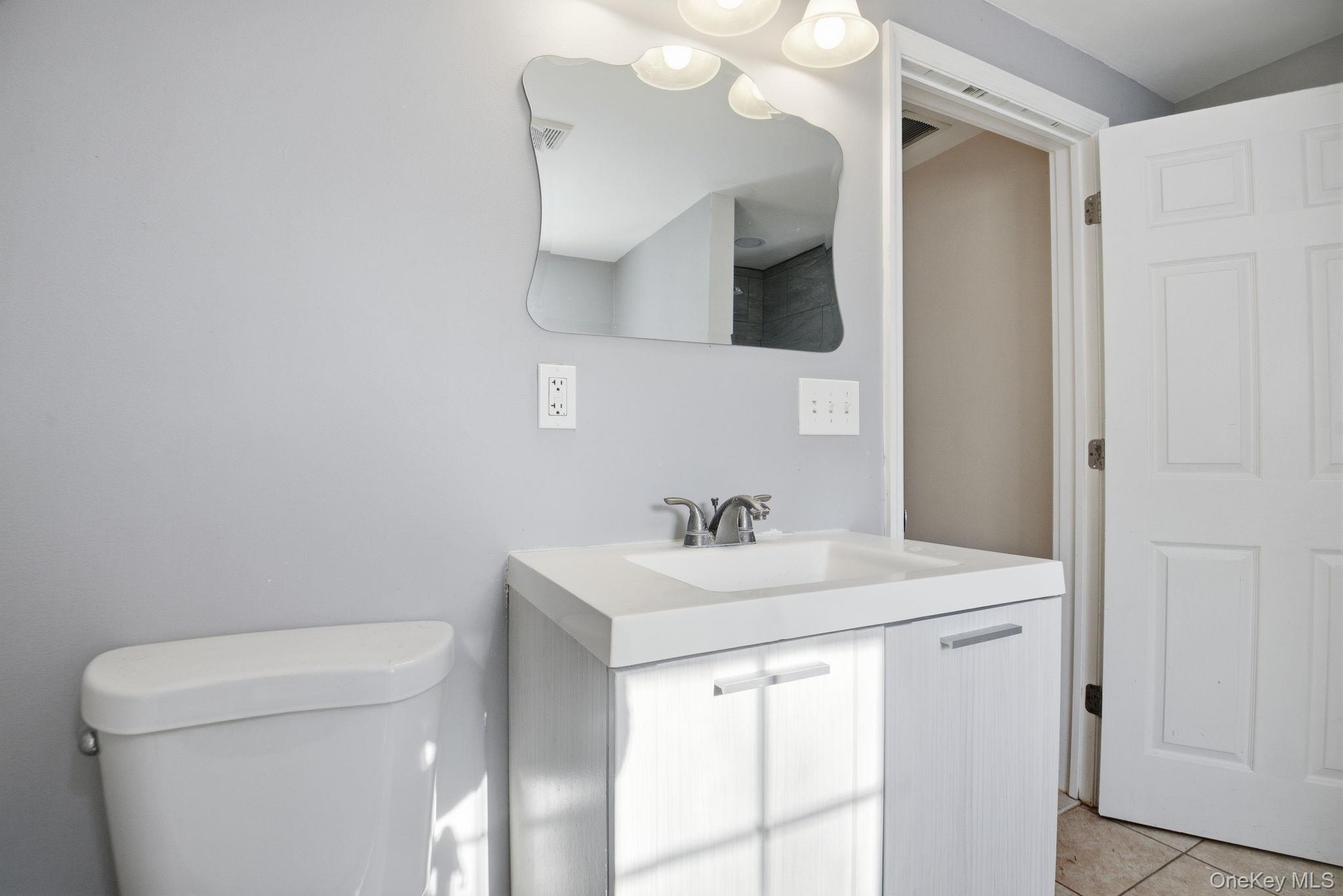 35 Shady Creek Road Pleasant Valley, NY 12569 - Photo 22 of 33 a bathroom with a toilet sink and mirror