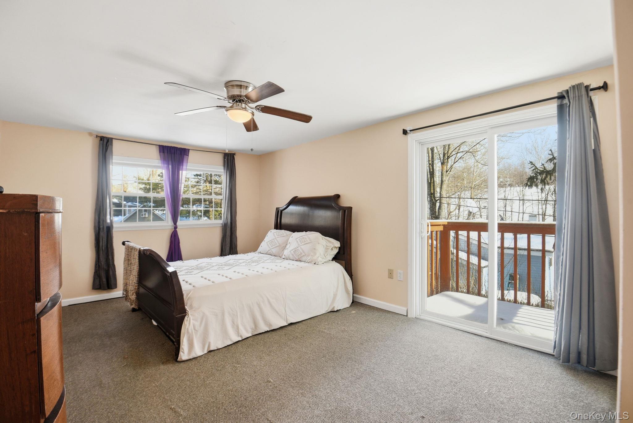 35 Shady Creek Road Pleasant Valley, NY 12569 - Photo 26 of 33 a bedroom with a bed and a large window