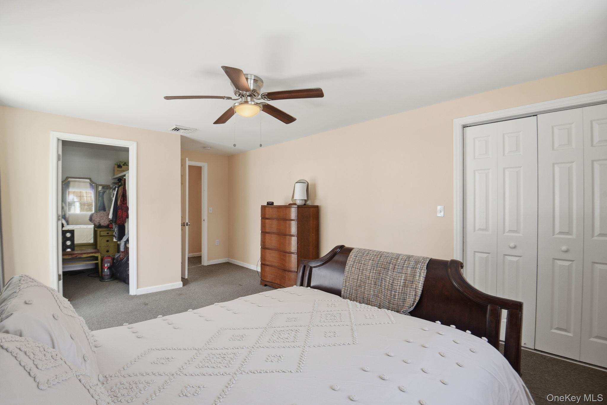 35 Shady Creek Road Pleasant Valley, NY 12569 - Photo 27 of 33 a bedroom with a bed and a chandelier