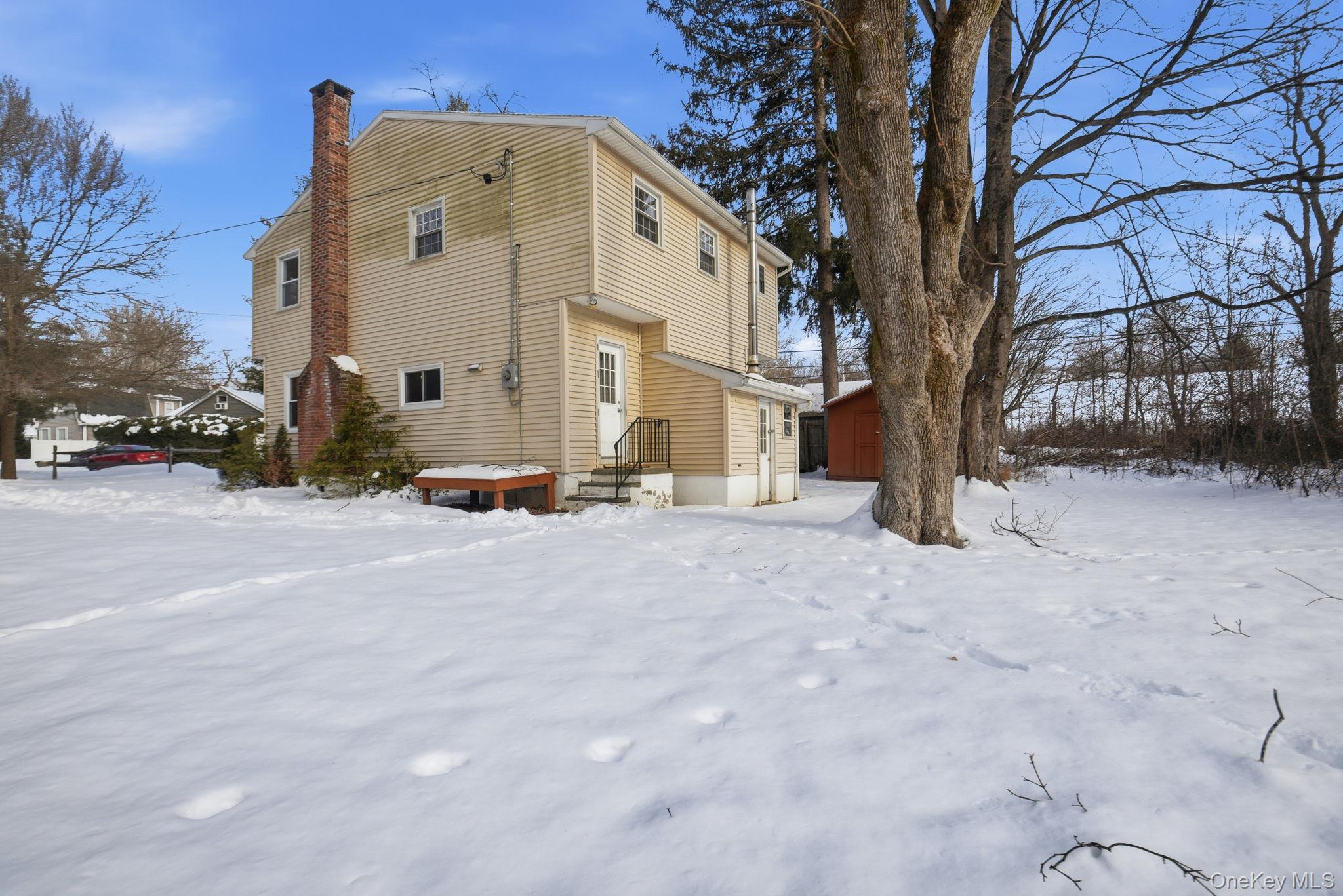 35 Shady Creek Road Pleasant Valley, NY 12569 - Photo 29 of 33 a view of a white house covered in snow