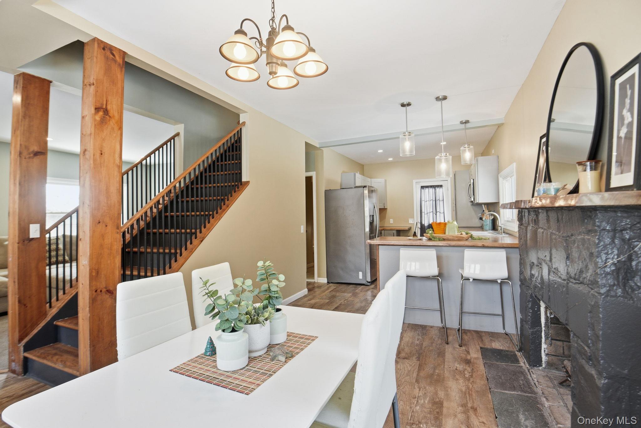 35 Shady Creek Road Pleasant Valley, NY 12569 - Photo 8 of 33 a view of a dining room with furniture a chandelier and wooden floor