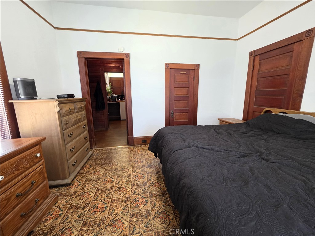 1414 Marin Street Corning, CA 96021 - Photo 26 of 43 a bedroom with a bed and a dresser