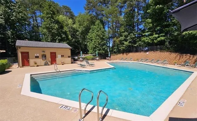 a view of a swimming pool with a patio