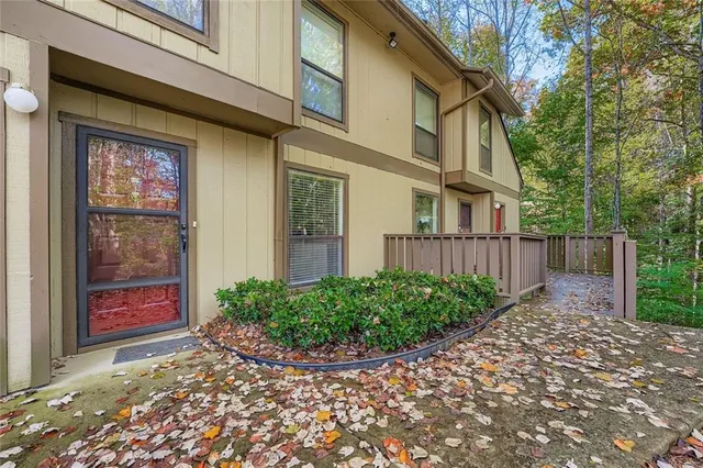 a view of a house with potted plants
