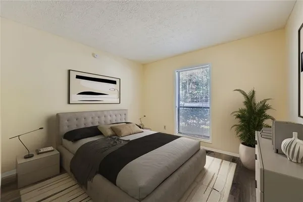 a bedroom with a large bed and a couch