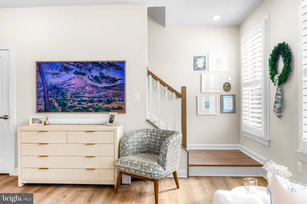 a bathroom with a toilet sink and a mirror