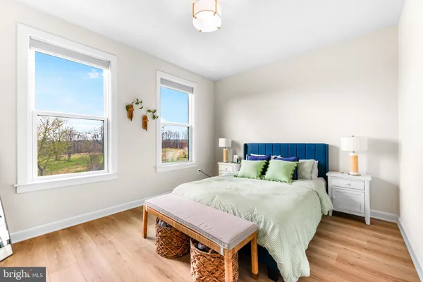 a bedroom with bed and a window