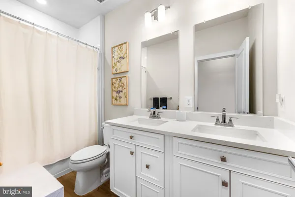 a front view of a building with a garden