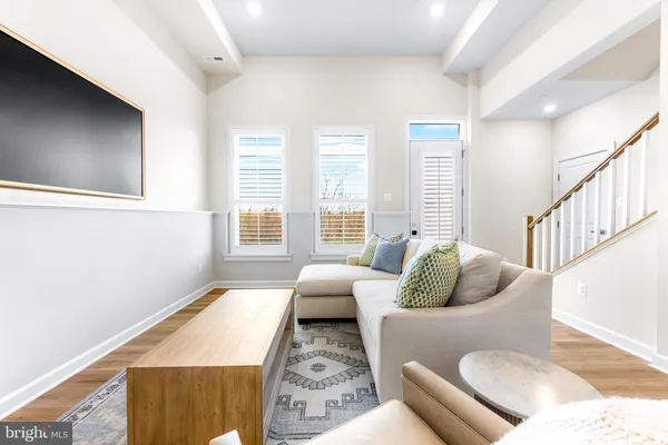 a kitchen with stainless steel appliances kitchen island granite countertop a sink a stove and a refrigerator