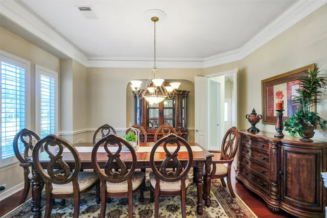 a bedroom with two beds and a chandelier