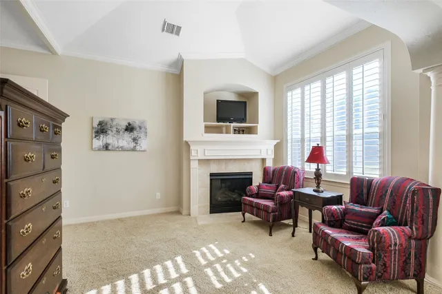 a bedroom with a bed and a ceiling fan