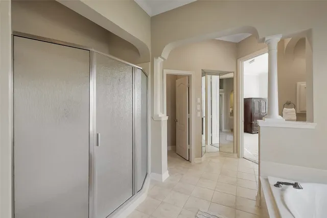 a view of a house with a big yard and large trees