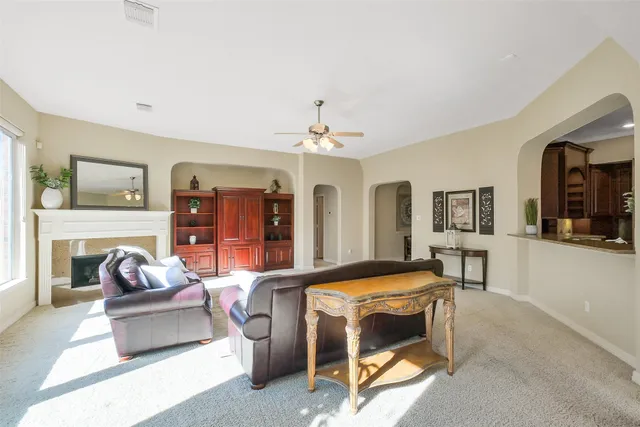a living room with furniture and a window