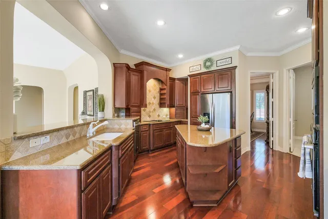 a living room with furniture a fireplace and a large window