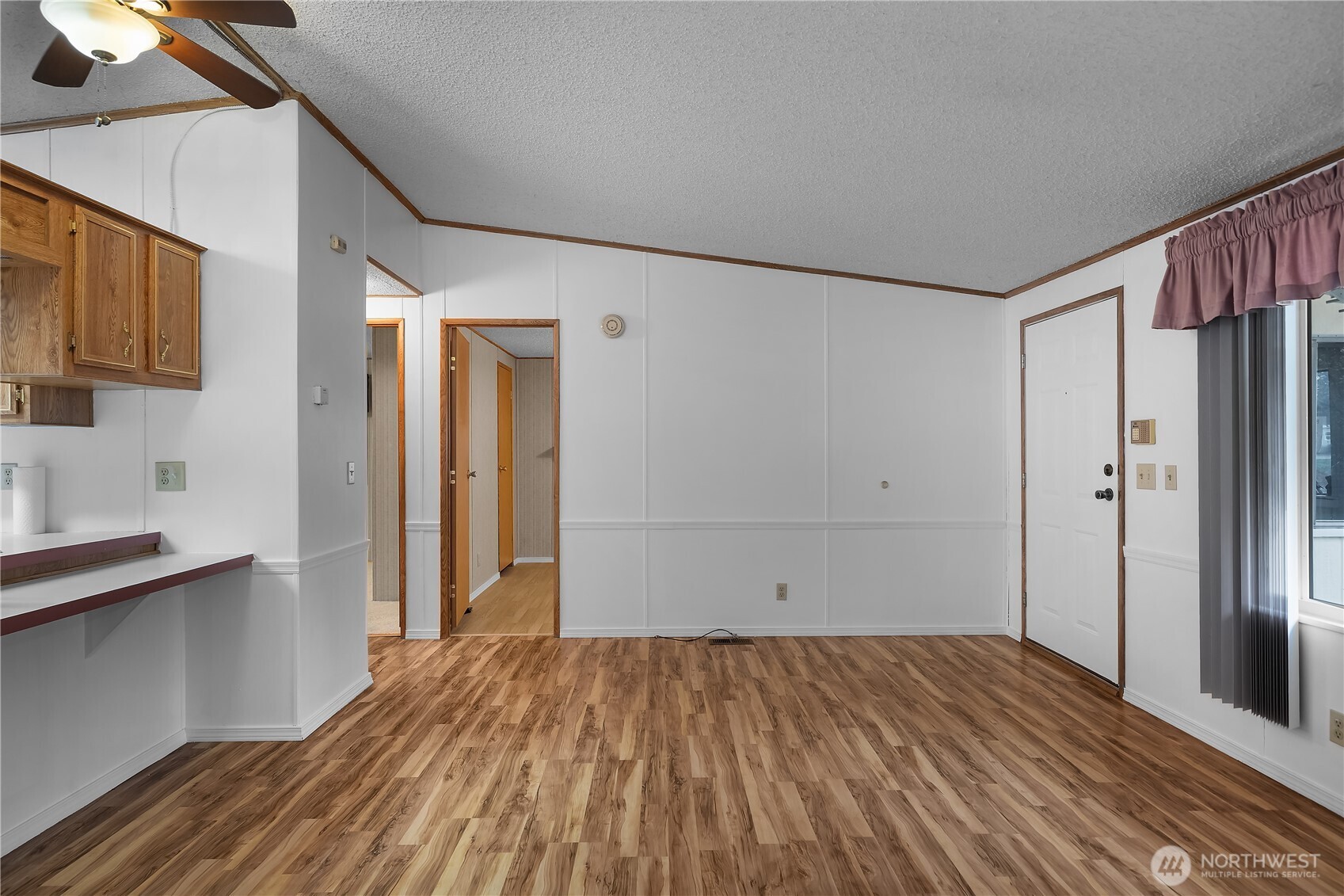930 Trosper Road Southwest, Unit 78 Tumwater, WA 98512 - Photo 12 of 36 a view of empty room with wooden floor and fan