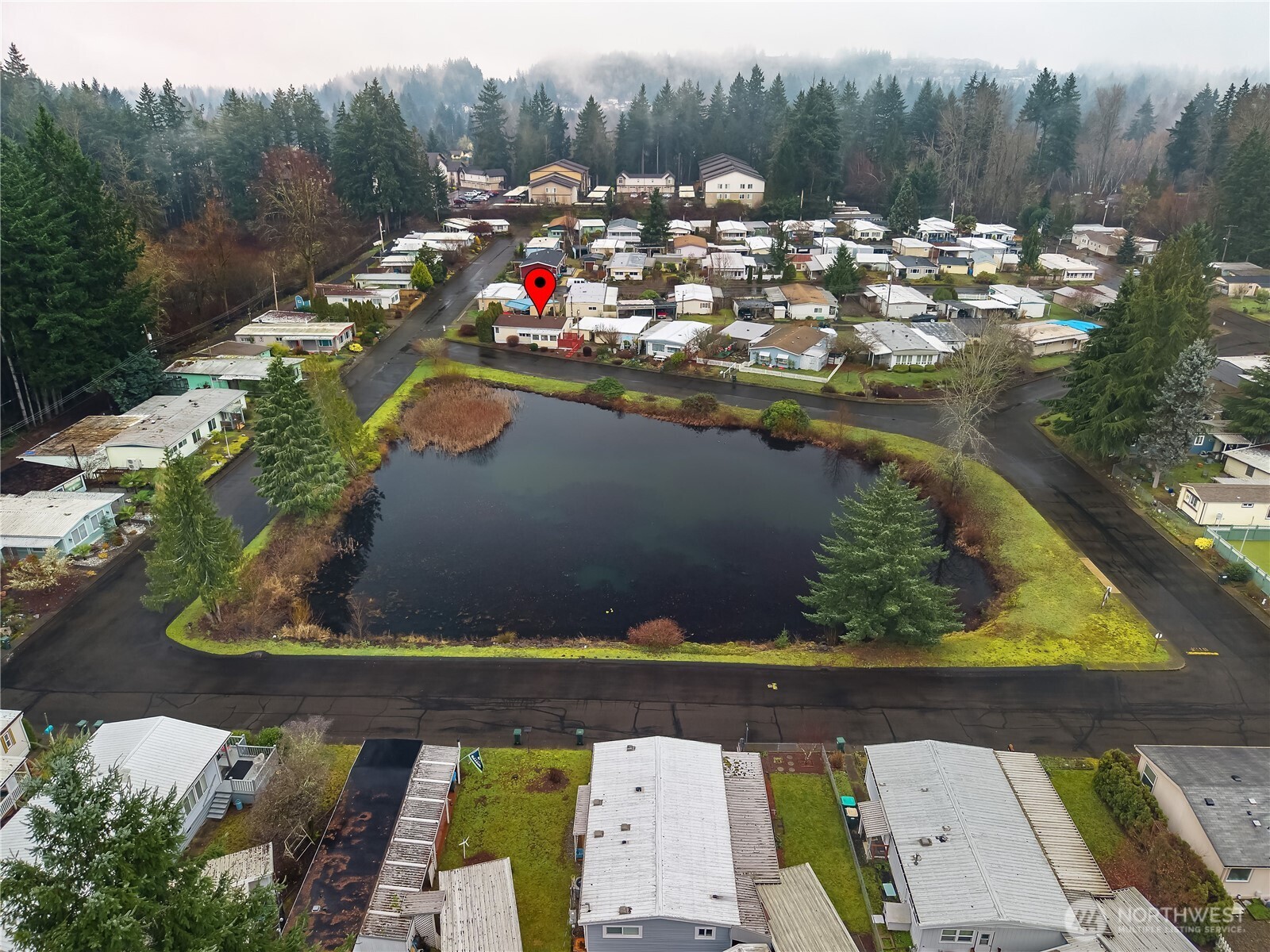 930 Trosper Road Southwest, Unit 78 Tumwater, WA 98512 - Photo 2 of 36 an aerial view of a house with a yard