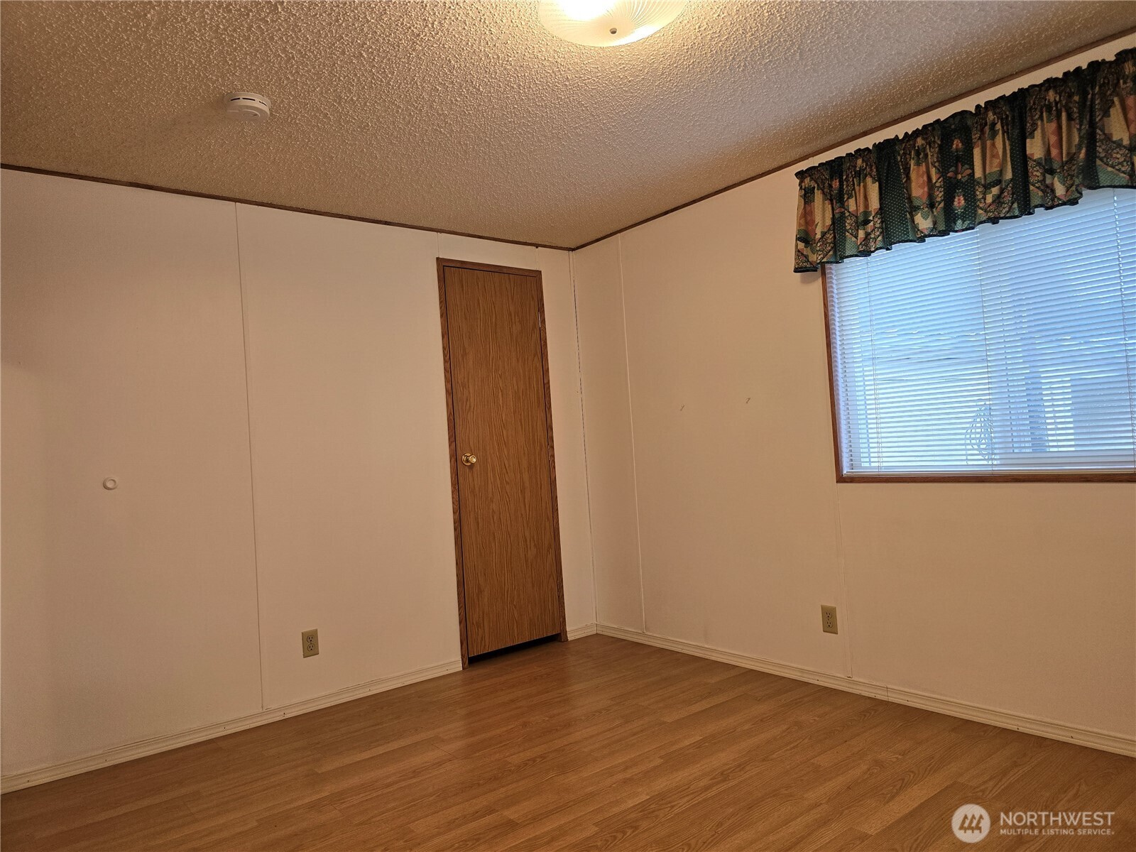 930 Trosper Road Southwest, Unit 78 Tumwater, WA 98512 - Photo 23 of 36 a view of walk in closet with wooden floor