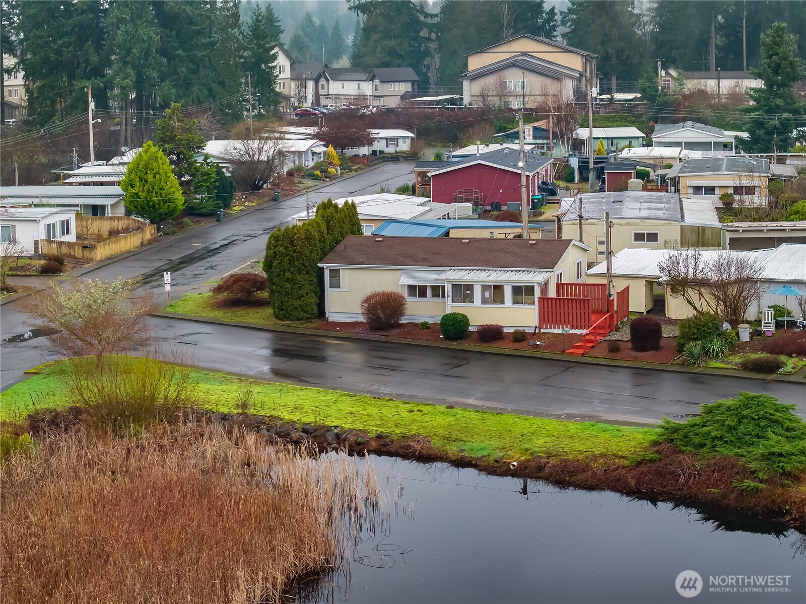 930 Trosper Road Southwest, Unit 78 Tumwater, WA 98512 - Photo 3 of 36 an aerial view of a house with a yard basket ball court and outdoor seating