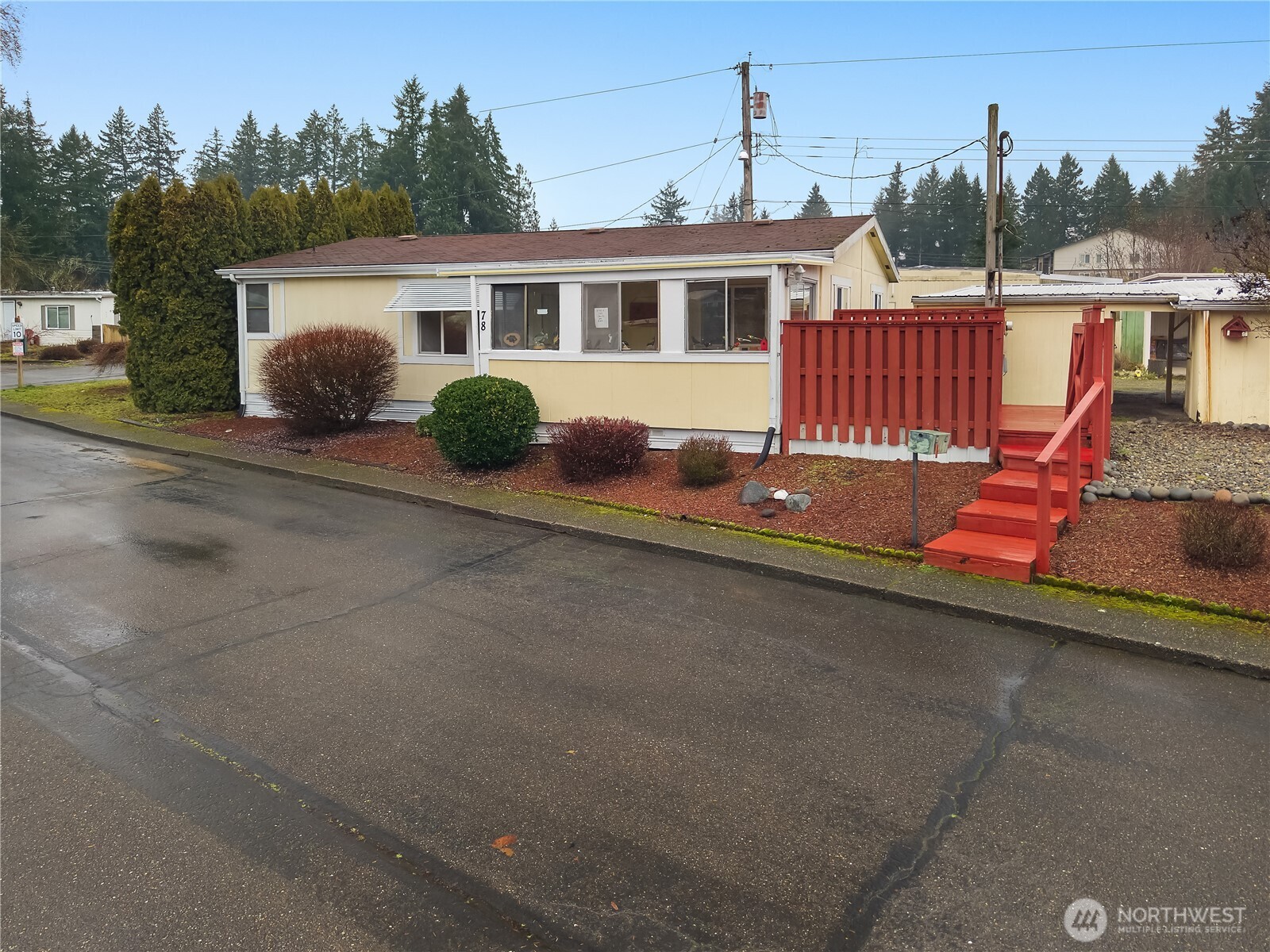 930 Trosper Road Southwest, Unit 78 Tumwater, WA 98512 - Photo 5 of 36 a front view of a house with garden