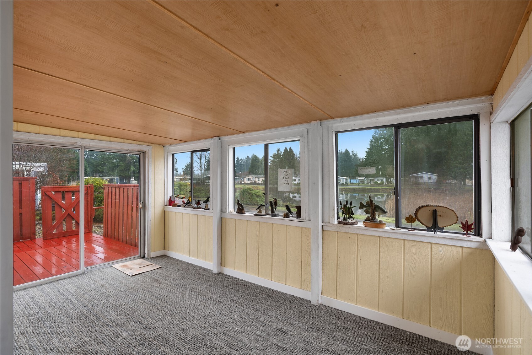 930 Trosper Road Southwest, Unit 78 Tumwater, WA 98512 - Photo 8 of 36 a view of a two room with wooden floor and windows
