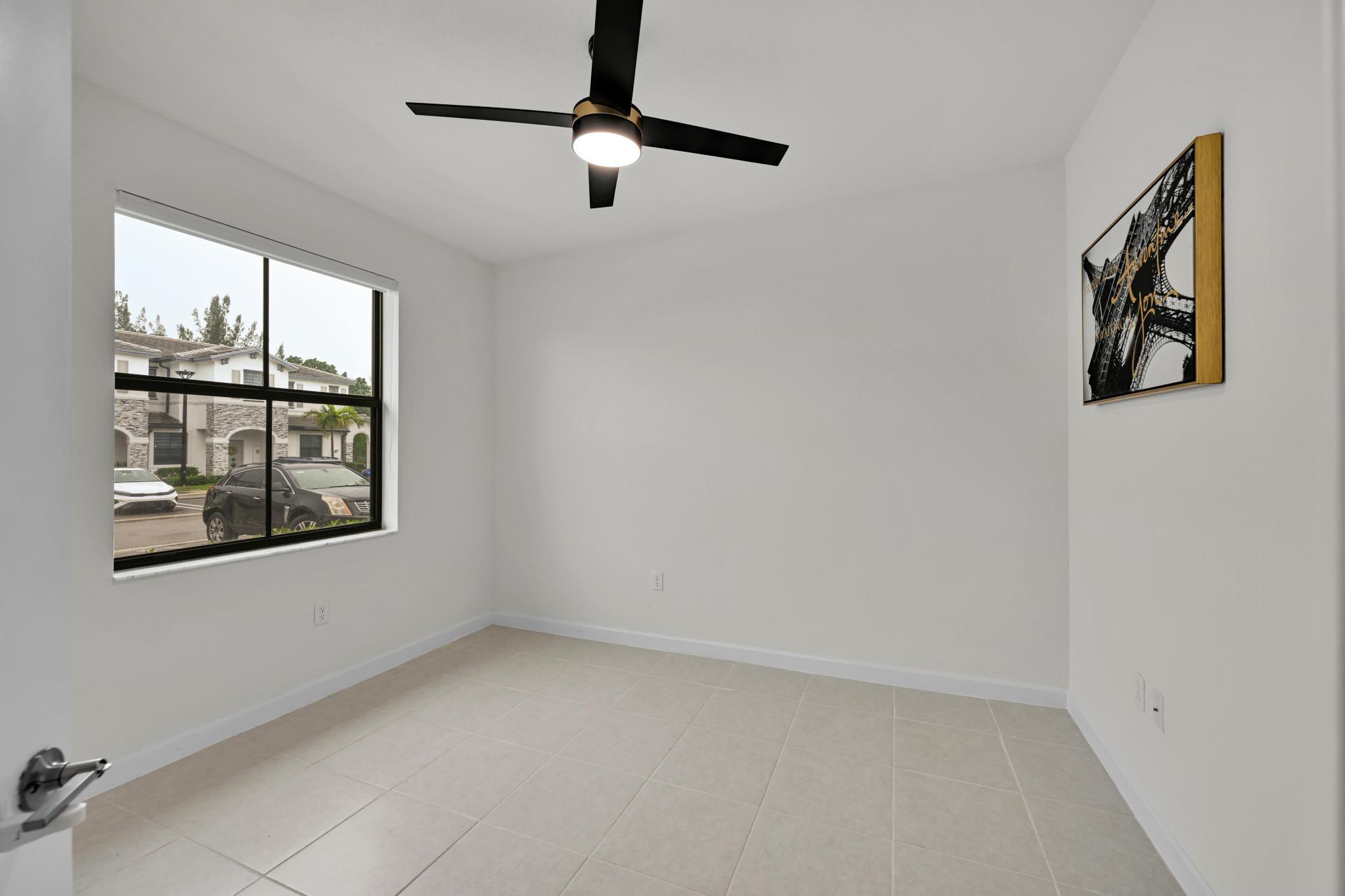 13234 Southwest 285th Street Homestead, FL 33033 - Photo 21 of 49 an empty room with windows