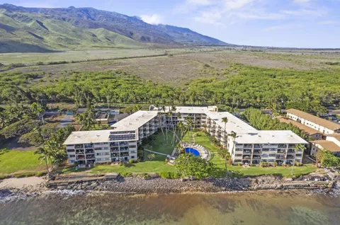 a aerial view of a house with a ocean view