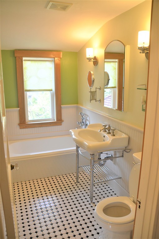 78 Walnut Street Needham, MA 02492 - Photo 17 of 24 a bathroom with a sink toilet a mirror and bathtub