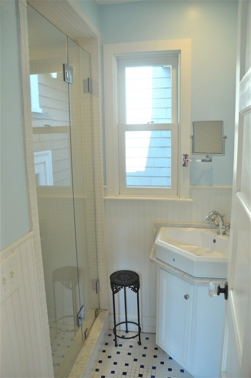 78 Walnut Street Needham, MA 02492 - Photo 4 of 24 a bathroom with a sink a toilet a shower and a mirror