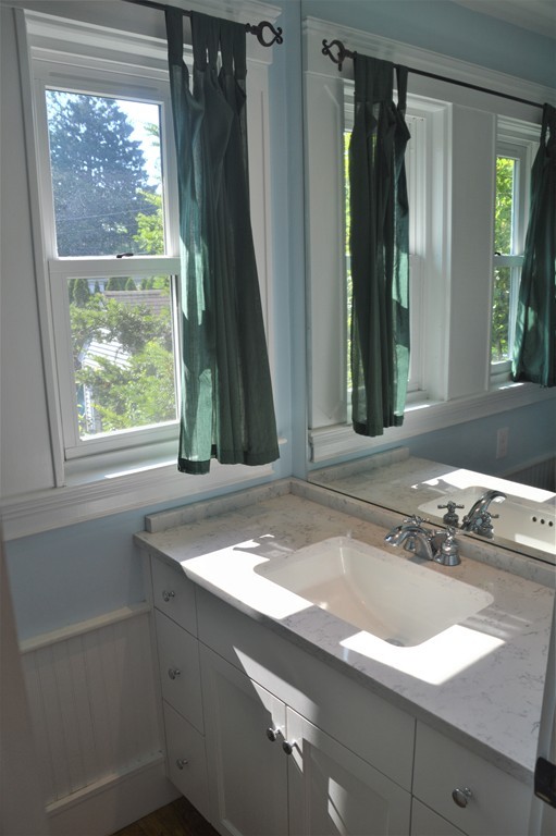 78 Walnut Street Needham, MA 02492 - Photo 5 of 24 a bathroom with a sink and a mirror