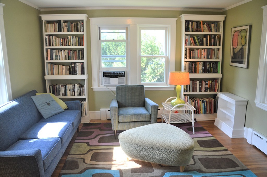 78 Walnut Street Needham, MA 02492 - Photo 6 of 24 a living room with furniture and a book shelf