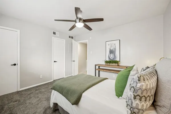 a bedroom with bed and window