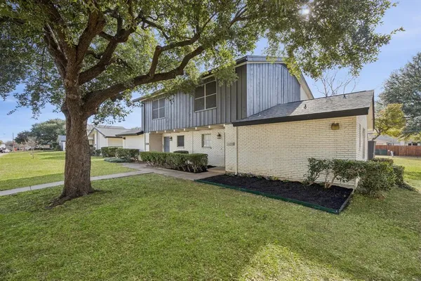 a house view with a garden space