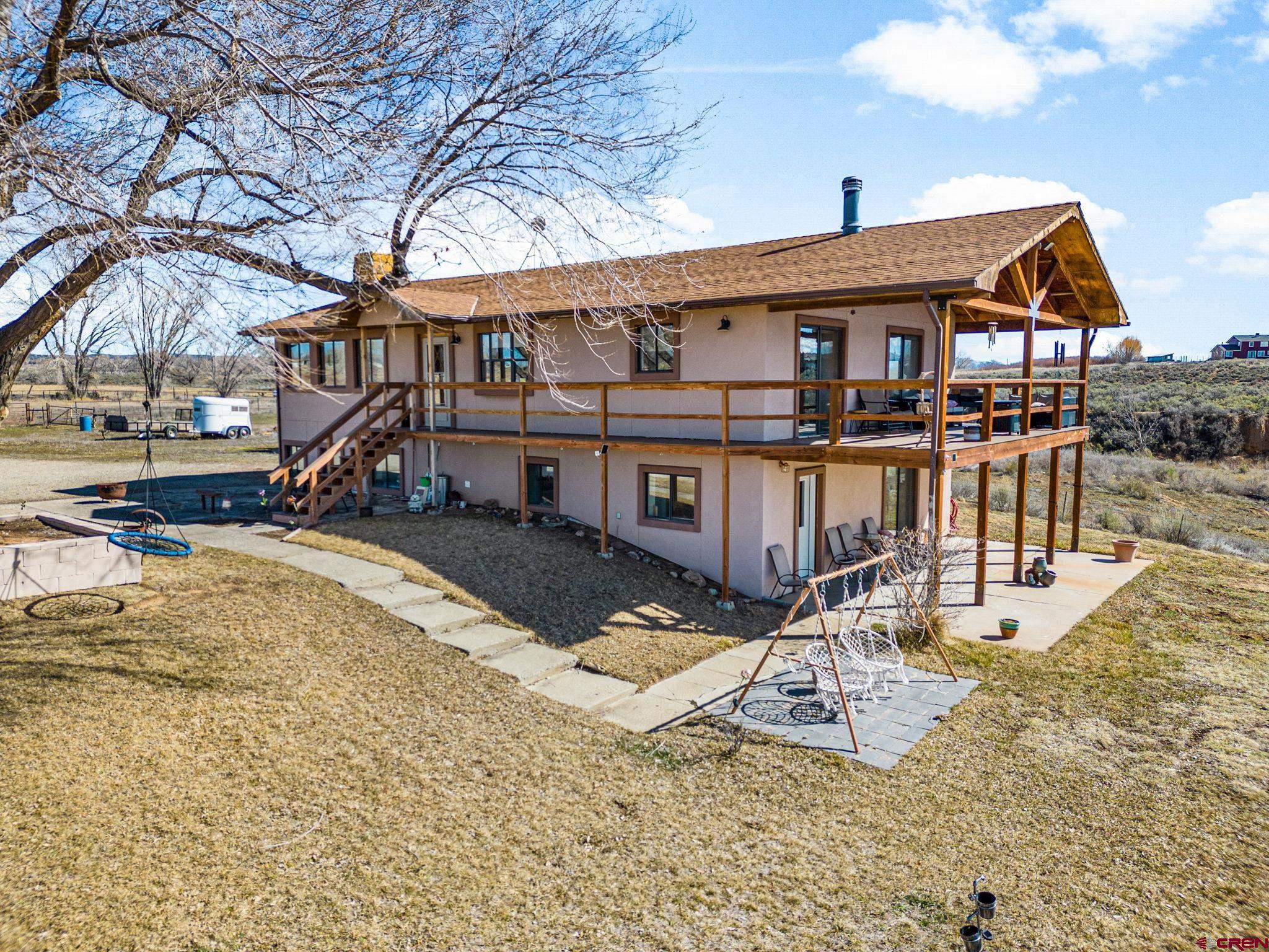 25220 County Rd M Cortez, CO 81321 - Photo 19 of 45 a front view of a house with swimming pool