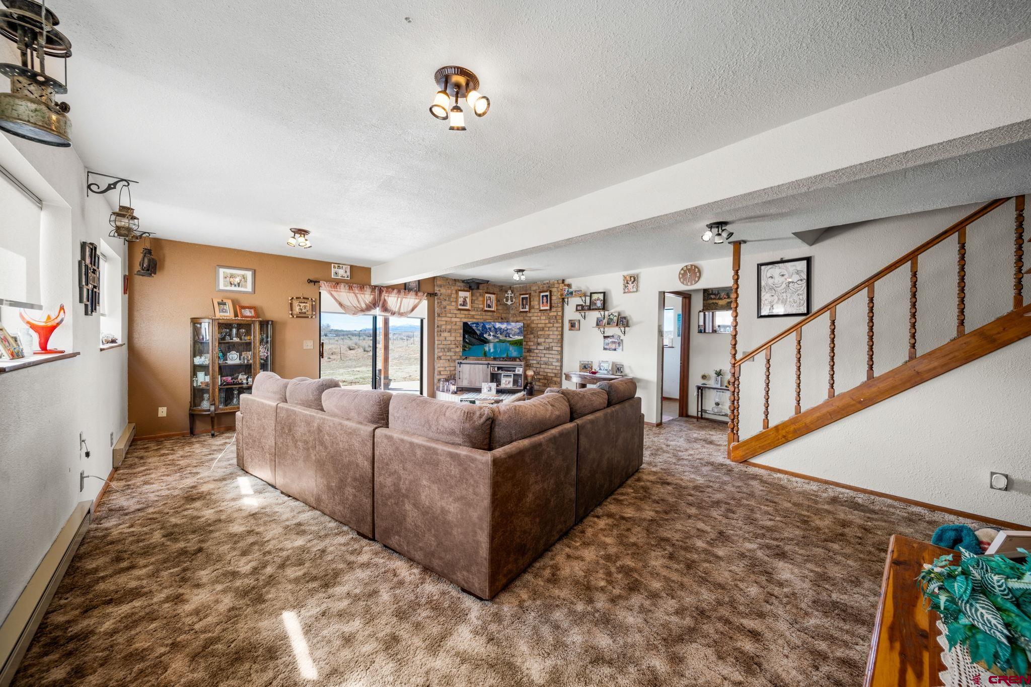 25220 County Rd M Cortez, CO 81321 - Photo 27 of 45 a living room with furniture and a flat screen tv