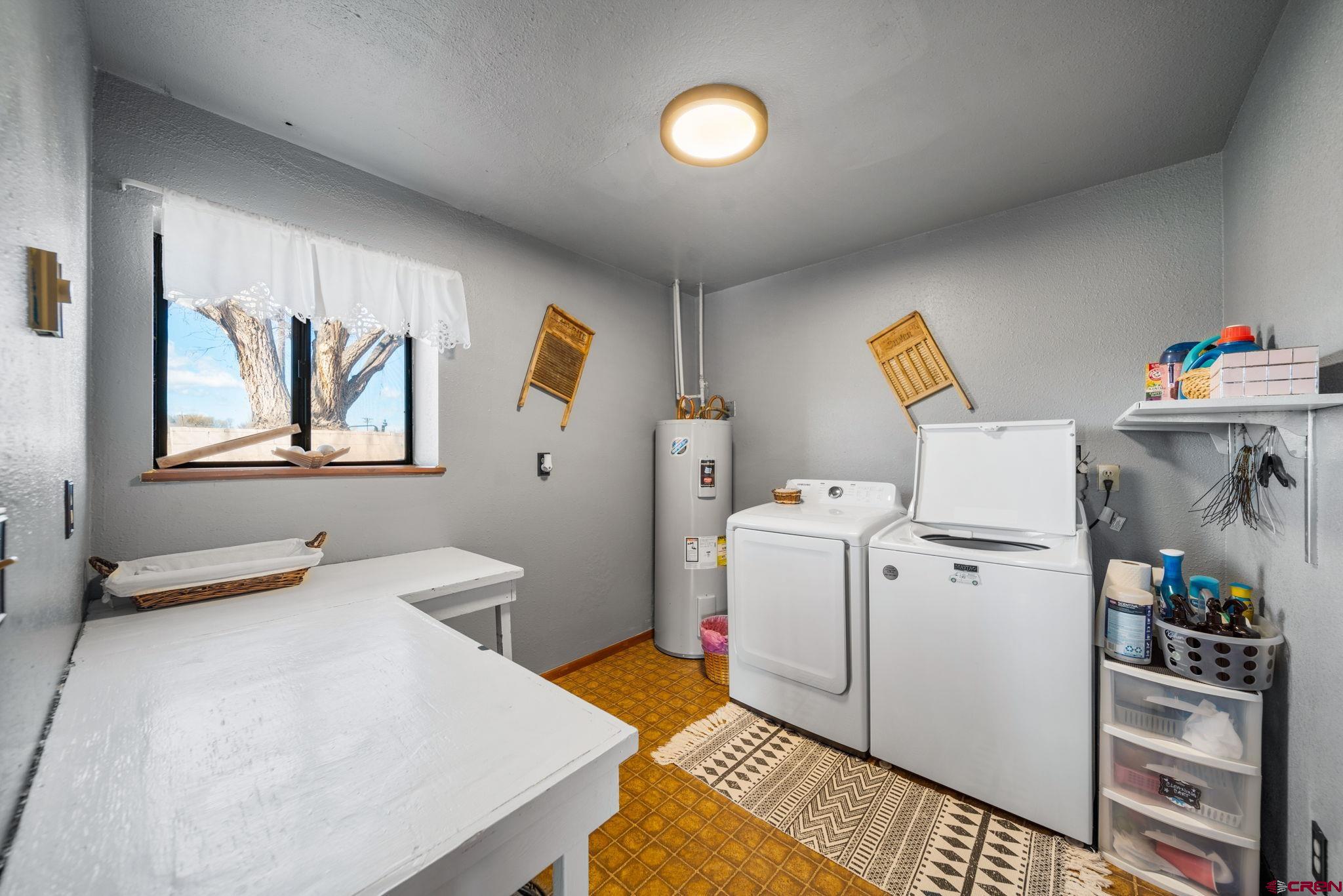 25220 County Rd M Cortez, CO 81321 - Photo 3 of 45 a bedroom with a bed and a couch