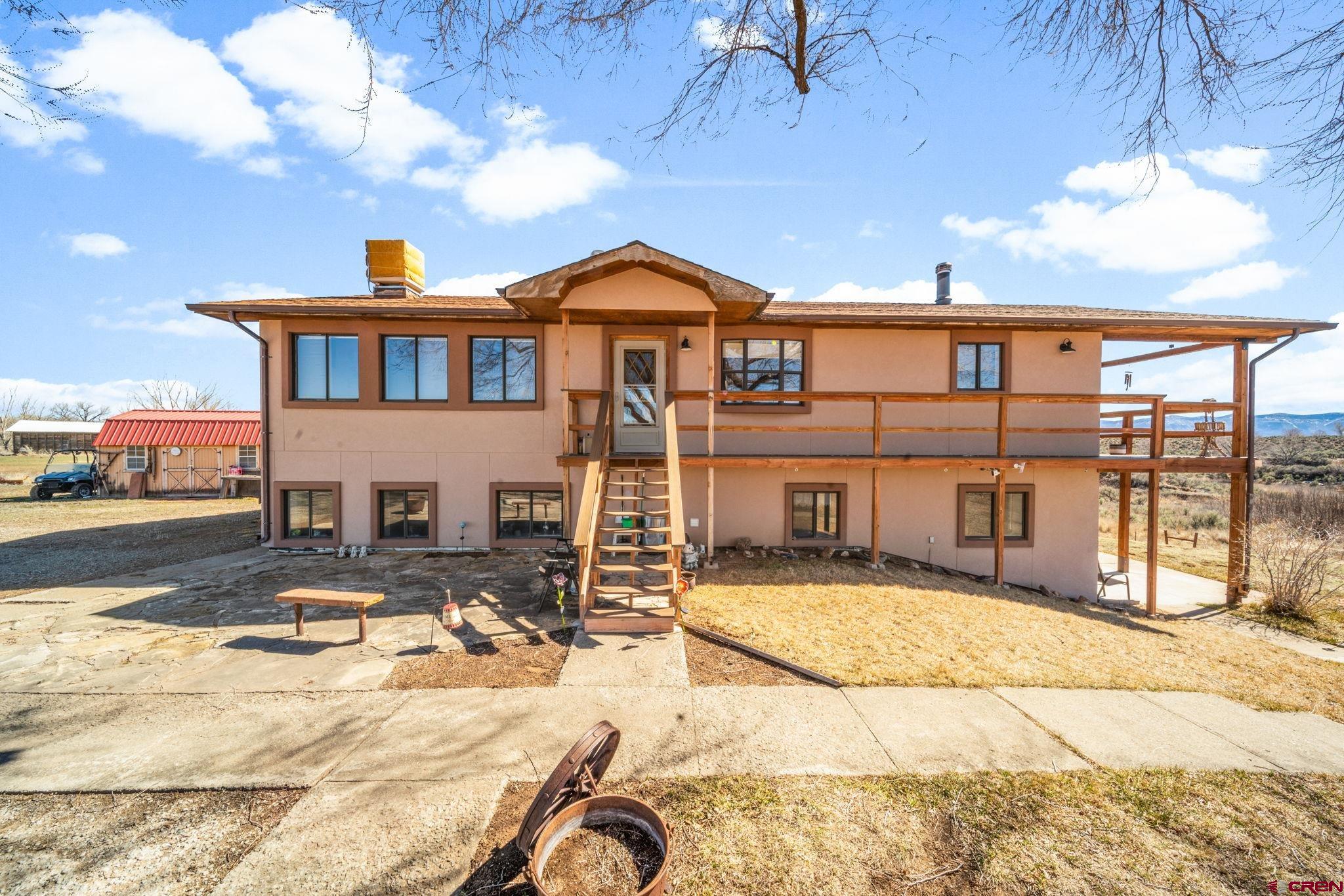 25220 County Rd M Cortez, CO 81321 - Photo 43 of 45 a view of a house with wooden floor next to a building