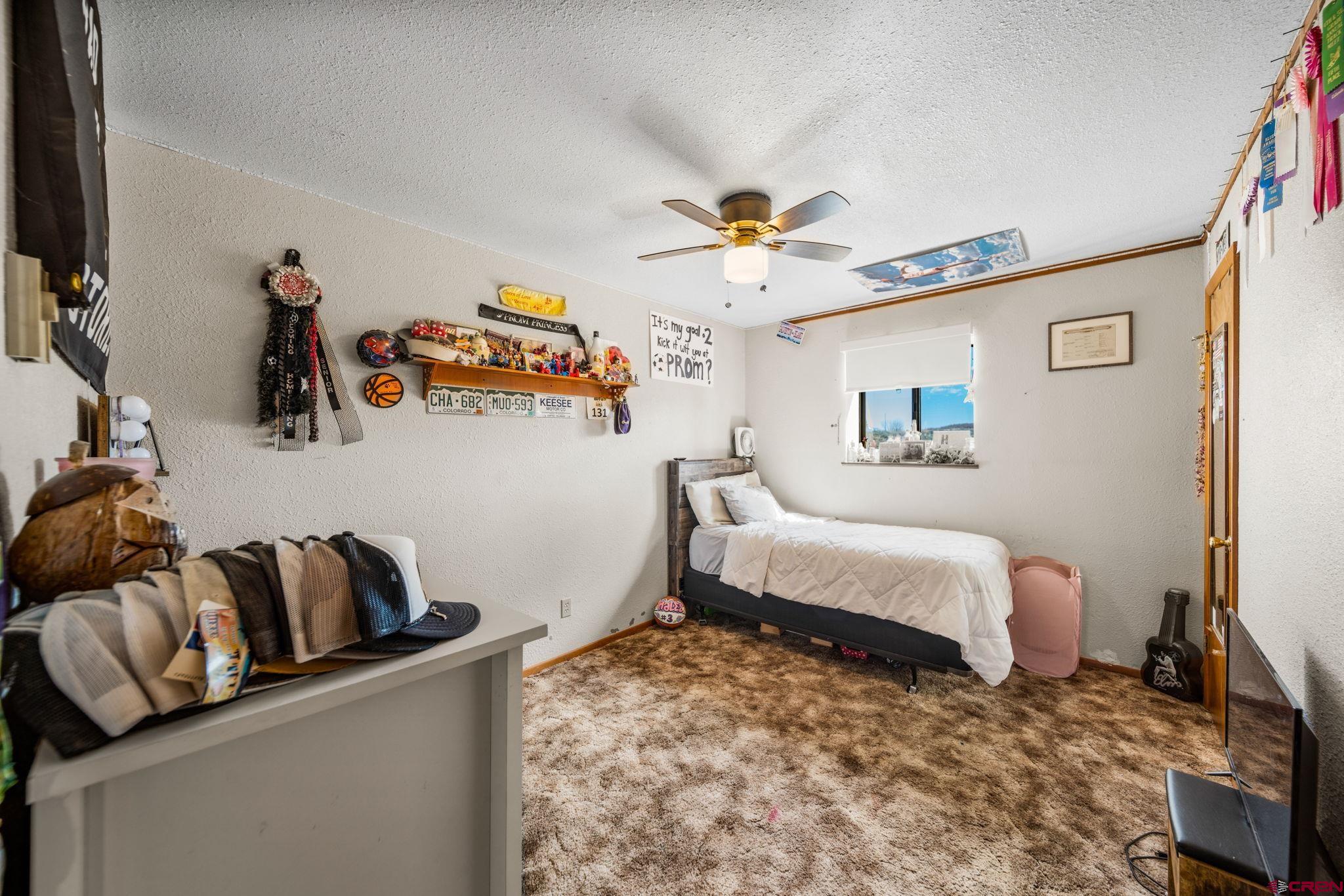 25220 County Rd M Cortez, CO 81321 - Photo 7 of 45 a bedroom with furniture and a flat screen tv