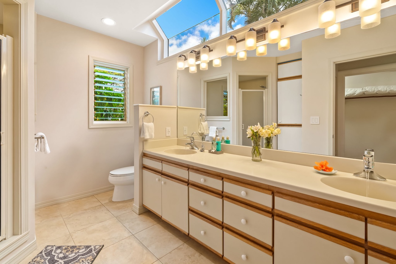2868 Milo Hae Loop Koloa, HI 96756 - Photo 17 of 30 a bathroom with a sink a toilet and a mirror