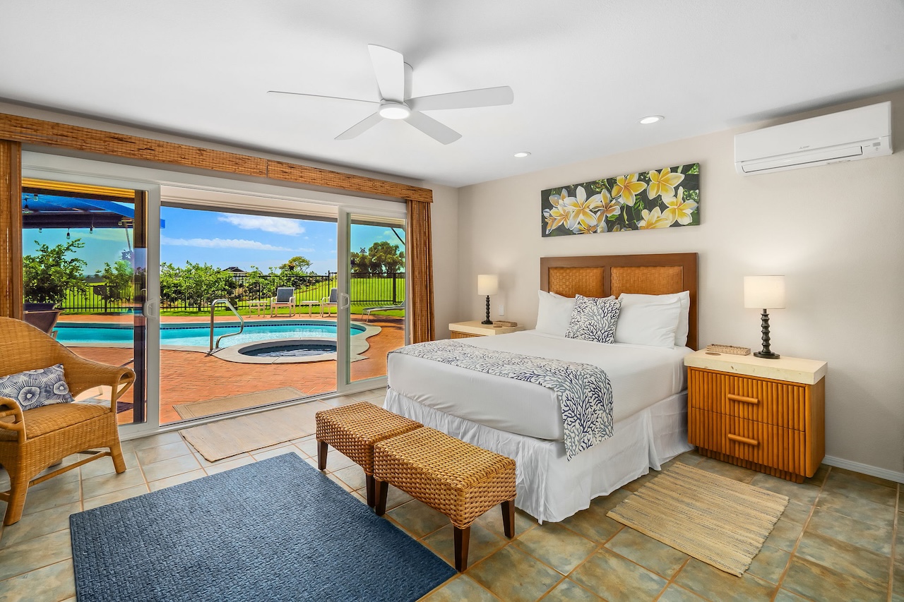 2868 Milo Hae Loop Koloa, HI 96756 - Photo 18 of 30 a bedroom with a bed and large window
