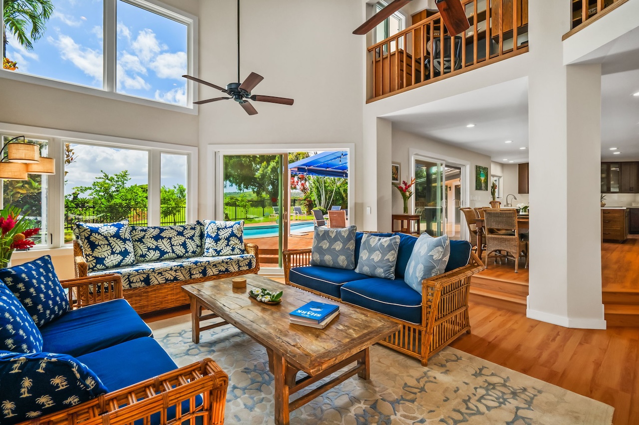 2868 Milo Hae Loop Koloa, HI 96756 - Photo 2 of 30 a living room with patio furniture and a floor to ceiling window