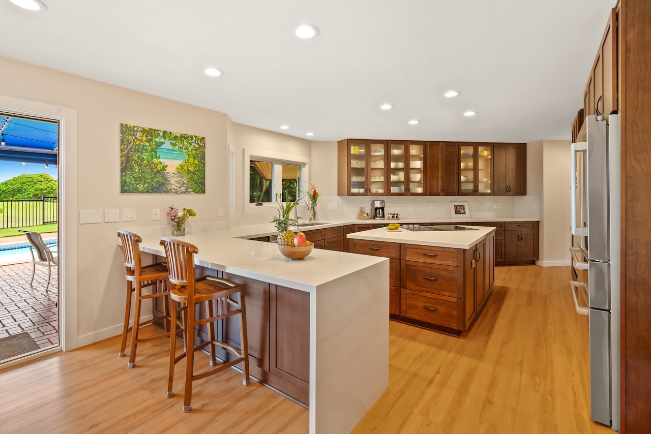 2868 Milo Hae Loop Koloa, HI 96756 - Photo 5 of 30 a kitchen with a sink a counter top space and stainless steel appliances