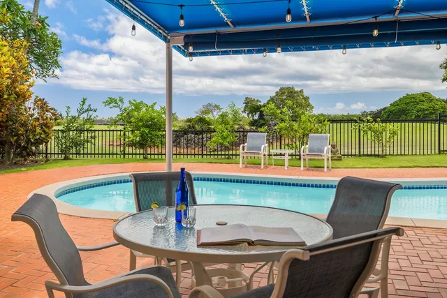 a roof deck with a table and chairs