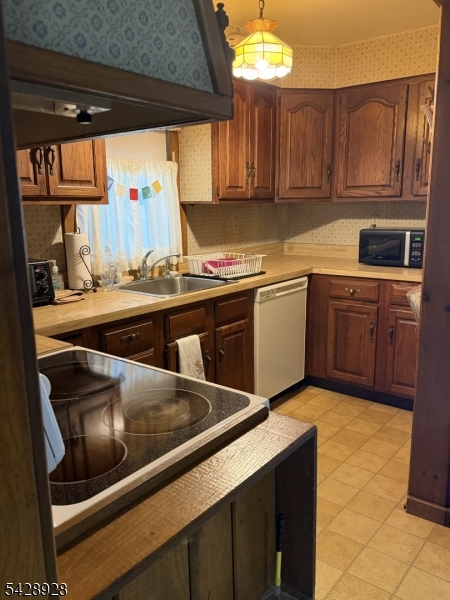 13 Cemetery Road Great Meadows, NJ 07838 - Photo 5 of 20 a kitchen with a sink a stove and cabinets